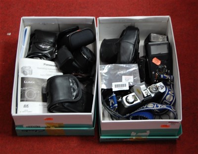 Lot 581 - Two boxes of assorted cameras and accessories,...