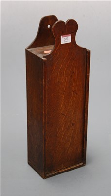 Lot 553 - A late George III oak candle box of typical...