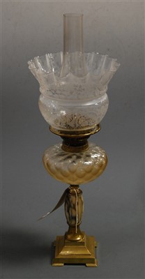 Lot 146 - An early 20th century oil lamp, having etched...