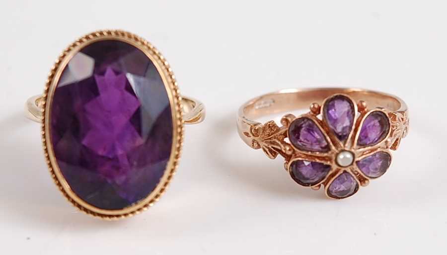 Lot 2520 - A pair of 9ct gold amethyst rings, one...