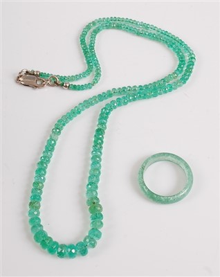 Lot 2524 - An emerald necklace, the 210 graduated faceted...