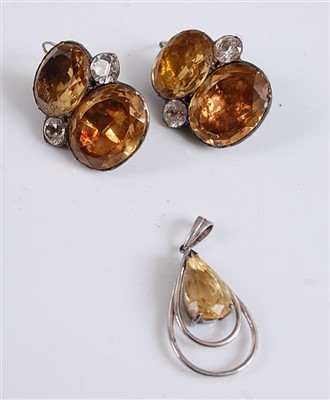 Lot 2530 - A white metal pear shaped citrine pendant,...