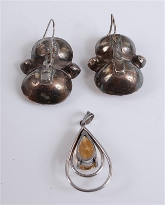 Lot 2530 - A white metal pear shaped citrine pendant,...