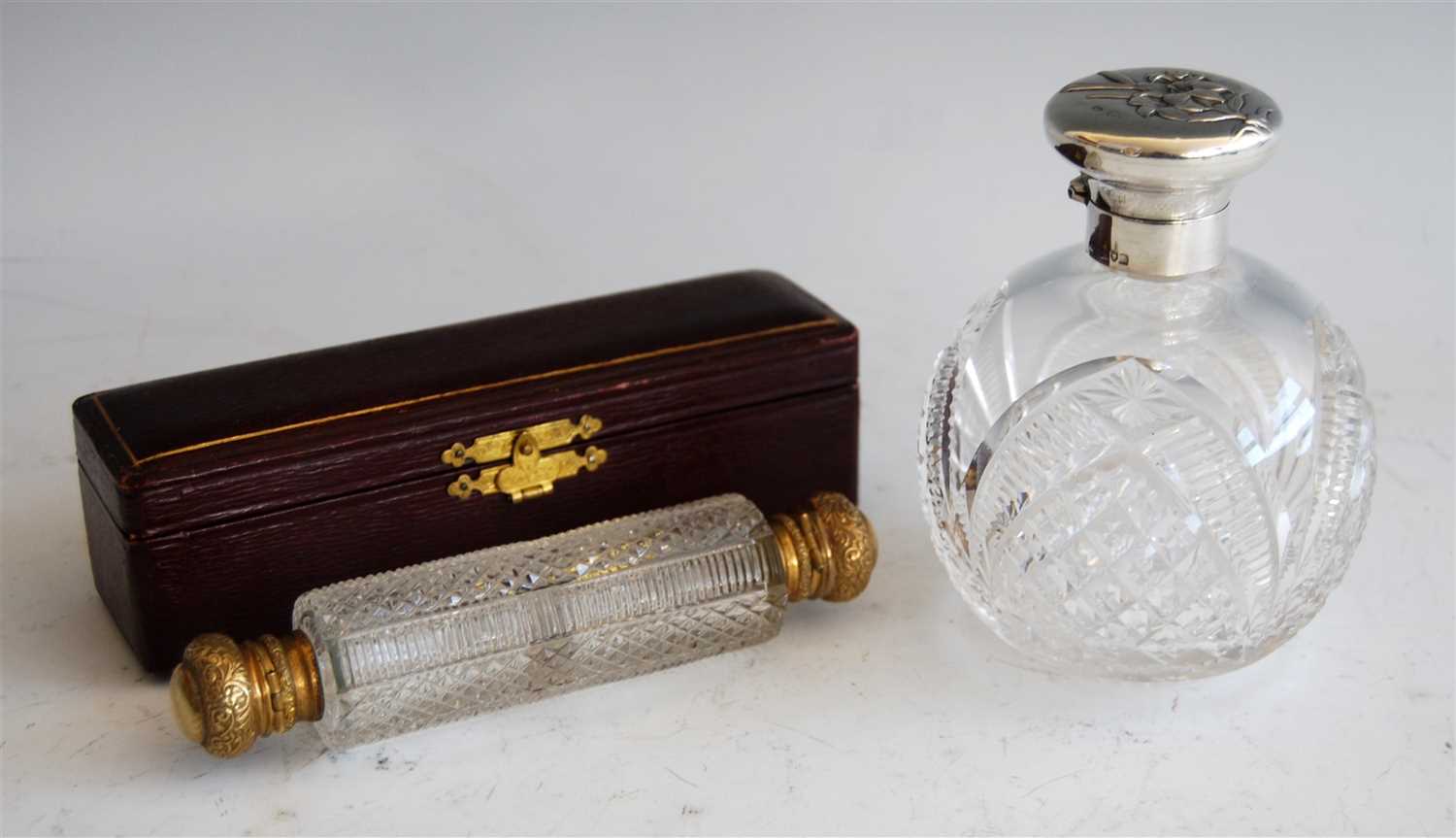 Lot 1078 - An Edwardian cut glass and silver topped scent...