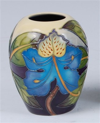 Lot 161 - A Moorcroft miniature pottery vase in the Blue...