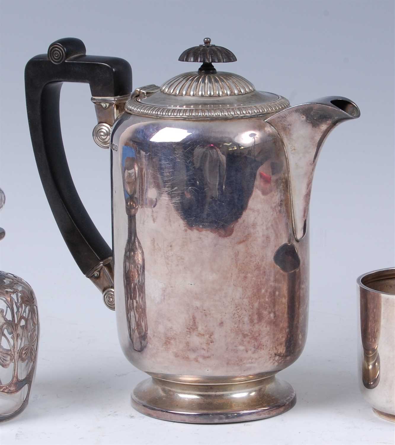 Lot 228 - An early Art Deco silver coffee pot, having an...