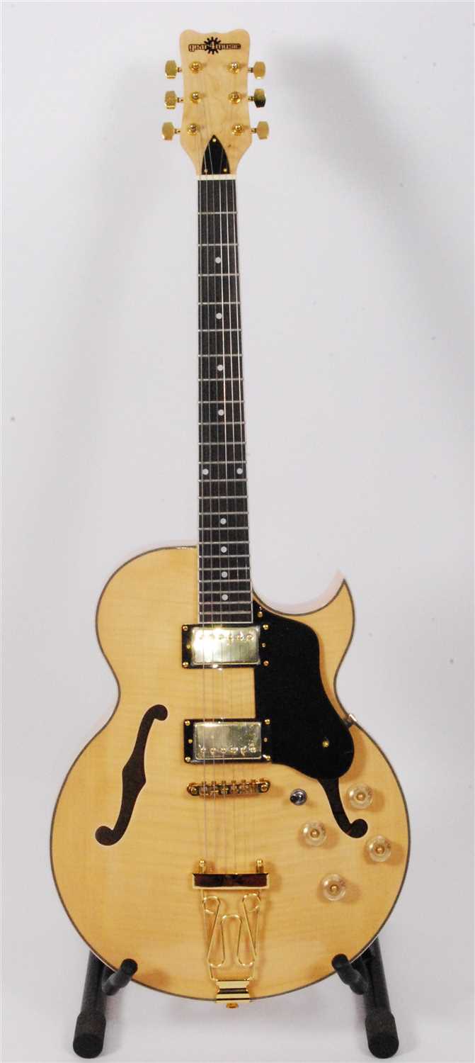 Lot 610 - A Gear4music ES/295 electro/accoustic guitar, in natural finish
