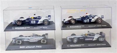 Lot 3218 - Four various plastic cased Scalextric F1...