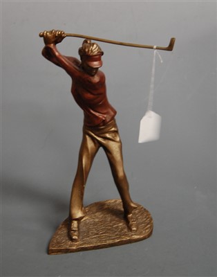 Lot 4 - A modern bronzed figure of a female golfer in...