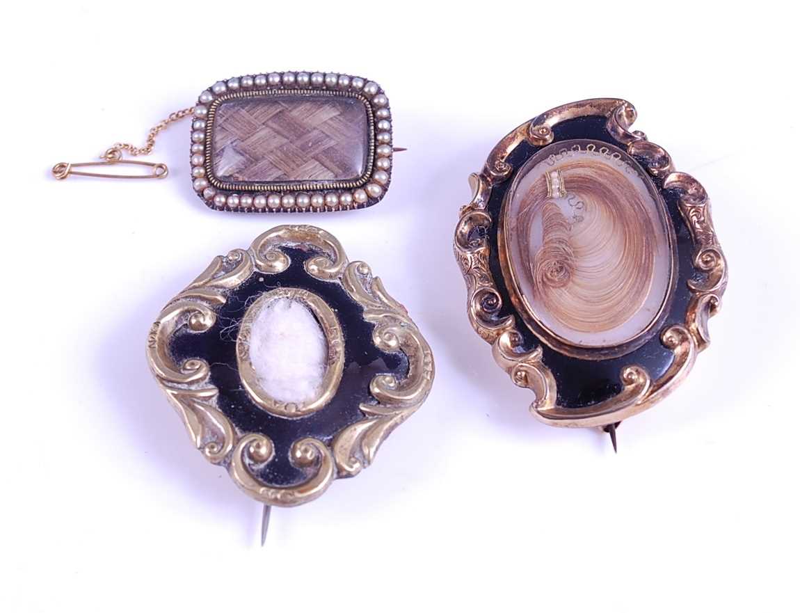 Lot 2566 - Three Victorian mourning brooches, consisting...