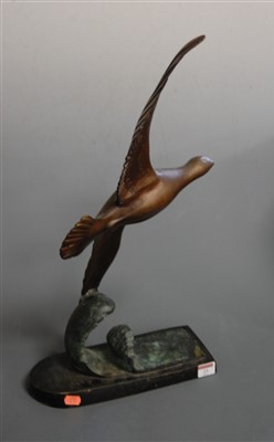 Lot 23 - An Art Deco bronzed figure of a bird in flight...