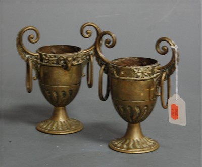 Lot 27 - A pair of Victorian gilt brass twin handled...