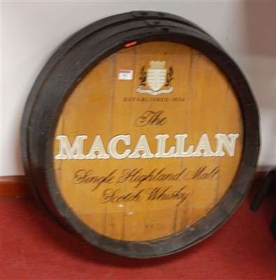 Lot 80 - A coopered oak barrel top advertising the...