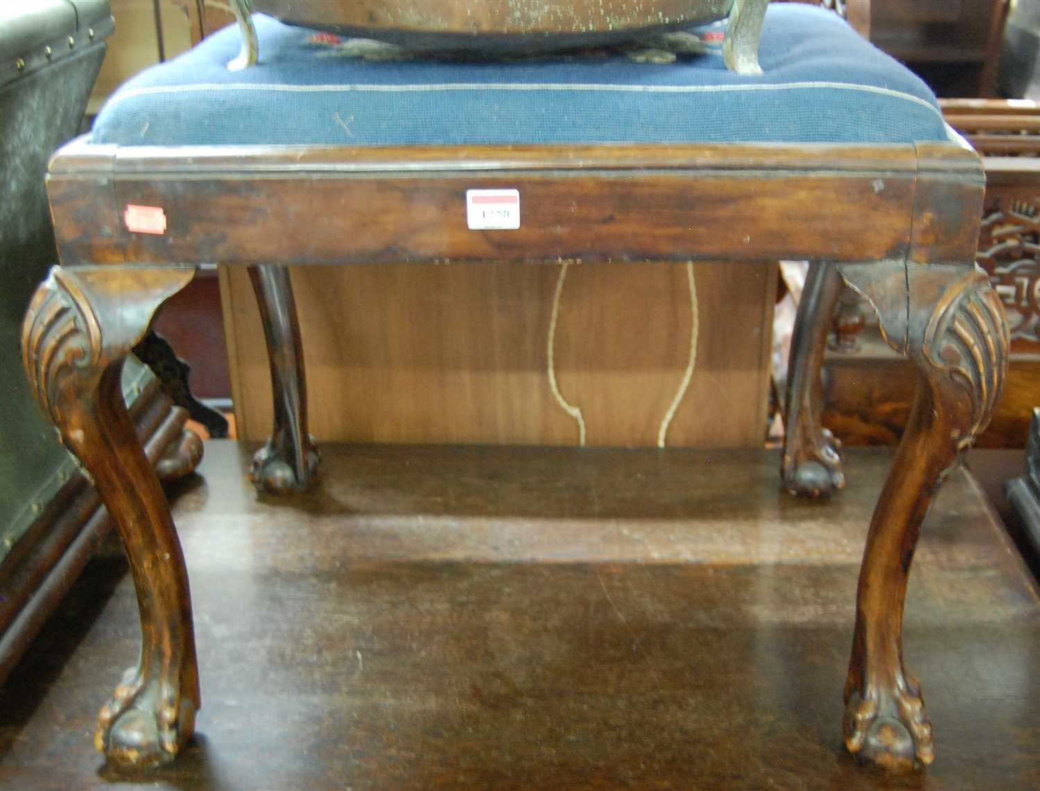 Lot 1258 - A Georgian style walnut dressing stool, having...