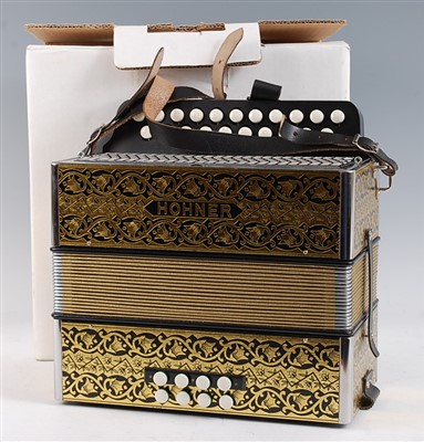 Lot 614 - A modern Hohner Erica 21 button accordion, boxed.