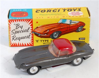 Lot 1676 - A Corgi Toys No. 307 E-type Jaguar with...