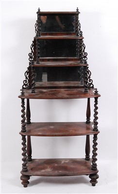 Lot 1411 - A Victorian walnut six-tier whatnot, the...