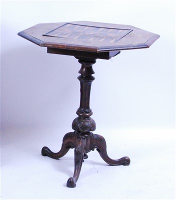 Lot 1415 - A Victorian figured walnut tripod games table,...