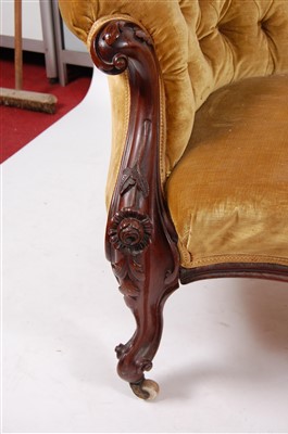 Lot 1465 - A Victorian rosewood framed settee, having a C-...