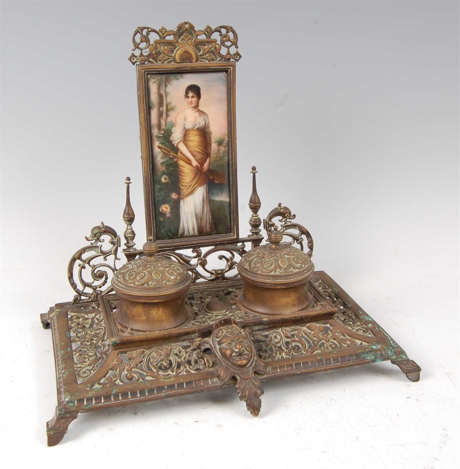 Lot 1270 - A Victorian brass desk stand, the raised back...