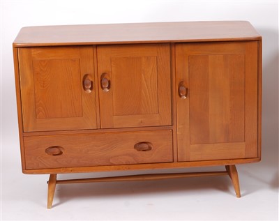 Lot 503 - A 1960s Ercol blond elm compact sideboard,...