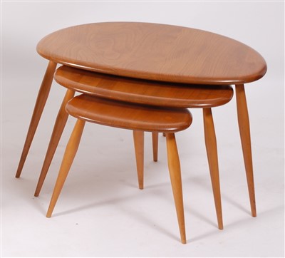 Lot 508 - A 1960s Ercol blond elm nest of three pebble...