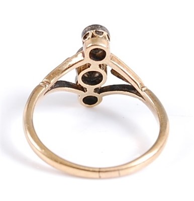 Lot 2602 - A yellow metal three-stone diamond ring, the...