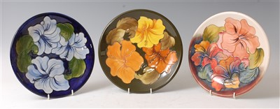 Lot 170 - Three Moorcroft pottery circular chargers, in...