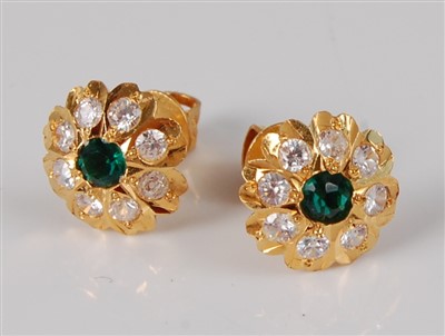 Lot 1182 - A pair of 22ct gold, synthetic emerald and...