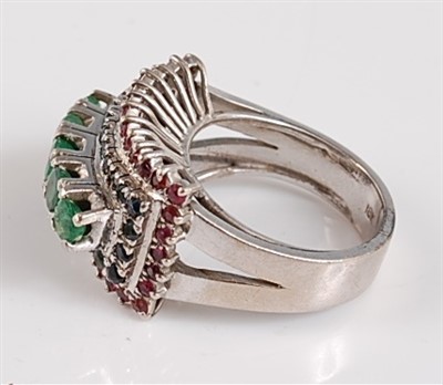 Lot 1186 - A white metal, emerald, sapphire and ruby...