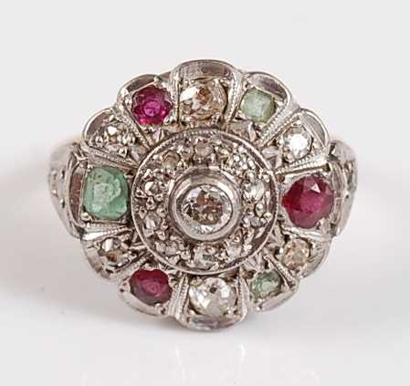Lot 1193 - An 18ct and platinum diamond, ruby and emerald...