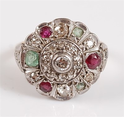 Lot 1193 - An 18ct and platinum diamond, ruby and emerald...