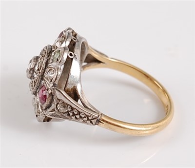 Lot 2120 - An 18ct and platinum diamond, ruby and emerald...