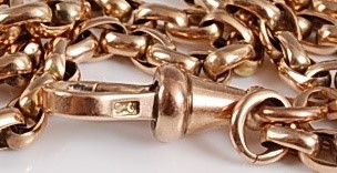 Lot 1197 - A yellow metal guard chain, oval belcher link...