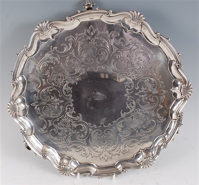 Lot 1079 - A George II silver salver, having floral and C-...