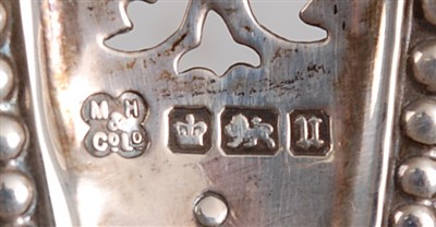 Lot 1085 - A George V silver basket, of pierced oval form...