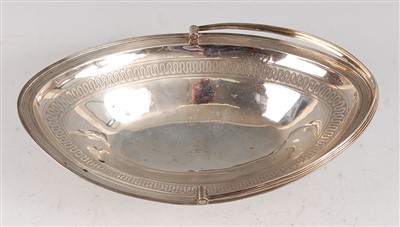 Lot 1090 - A large George III silver bread basket, of...