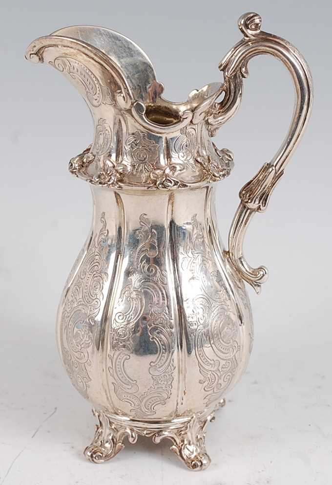 Lot 1116 - An early Victorian silver jug, of fluted...