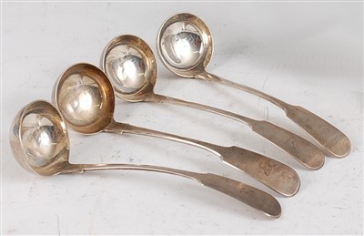 Lot 1117 - A set of four Scottish silver sauce ladles, in...