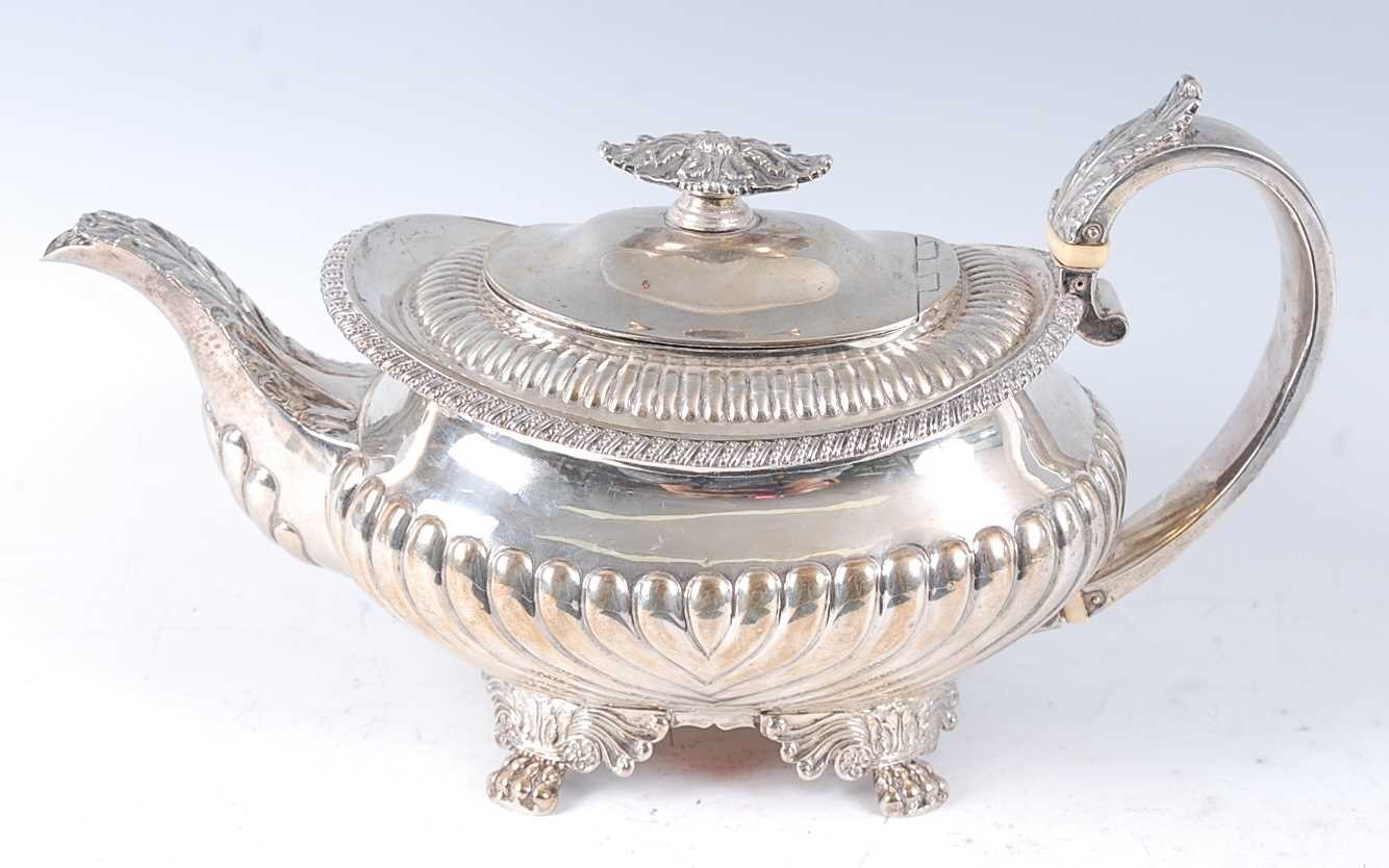 Lot 1137 - A George IV silver teapot, of squat oval form,...