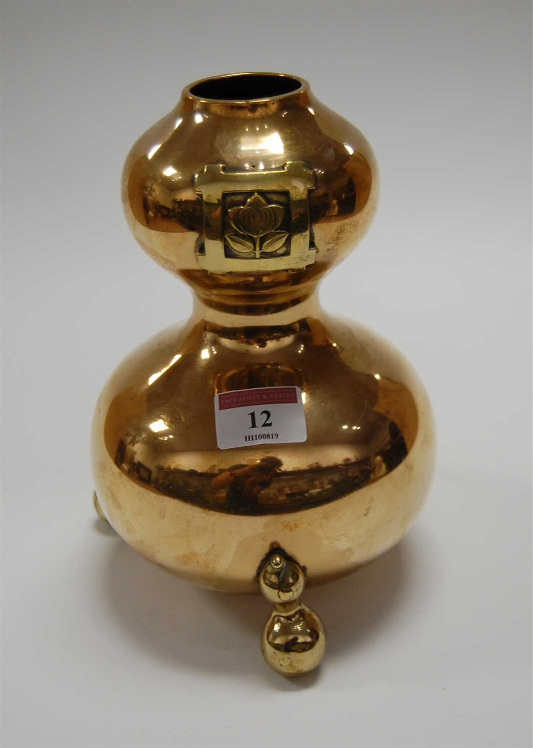 Lot 12 - A brass double-gourd vase, having embossed...