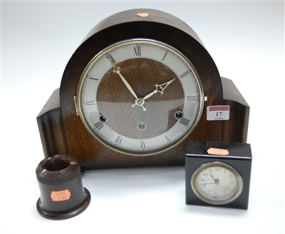 Lot 17 - A 1950s oak cased mantel clock, having a...