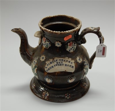 Lot 31 - A Victorian Bargeware teapot, on a typical...