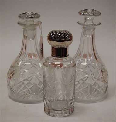 Lot 169 - A pair of cut crystal small decanters and...
