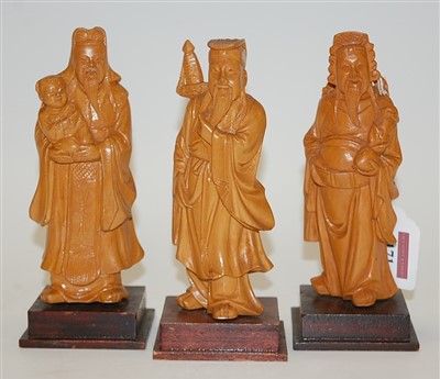 Lot 171 - A set of three modern Chinese softwood figure...