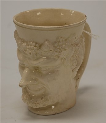 Lot 186 - A 19th century cream ware mug modelled as...