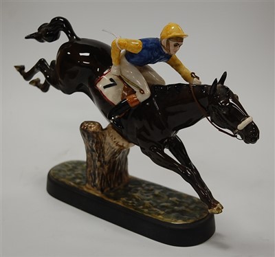 Lot 189 - A Beswick figure of a racehorse with jockey up...