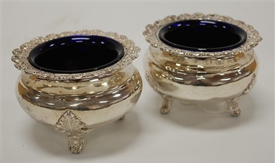 Lot 210 - A pair of continental white metal table salts...