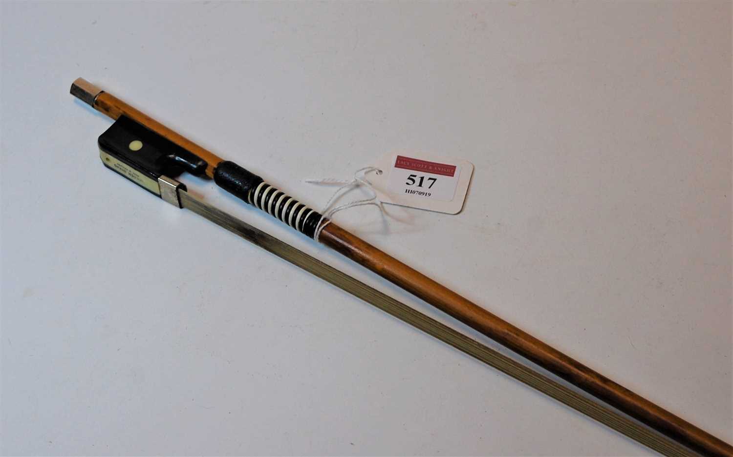 Lot 517 - A Golden Strand cello bow, 67cm