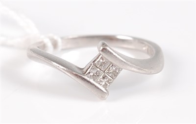 Lot 303 - A modern platinum and diamond ring, set with...